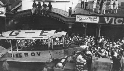 StateLibQld_1_123500_Bert_Hinkler's_Avro_Avian_aeroplane_paraded_in_Queen_Street,_Brisbane,_1928